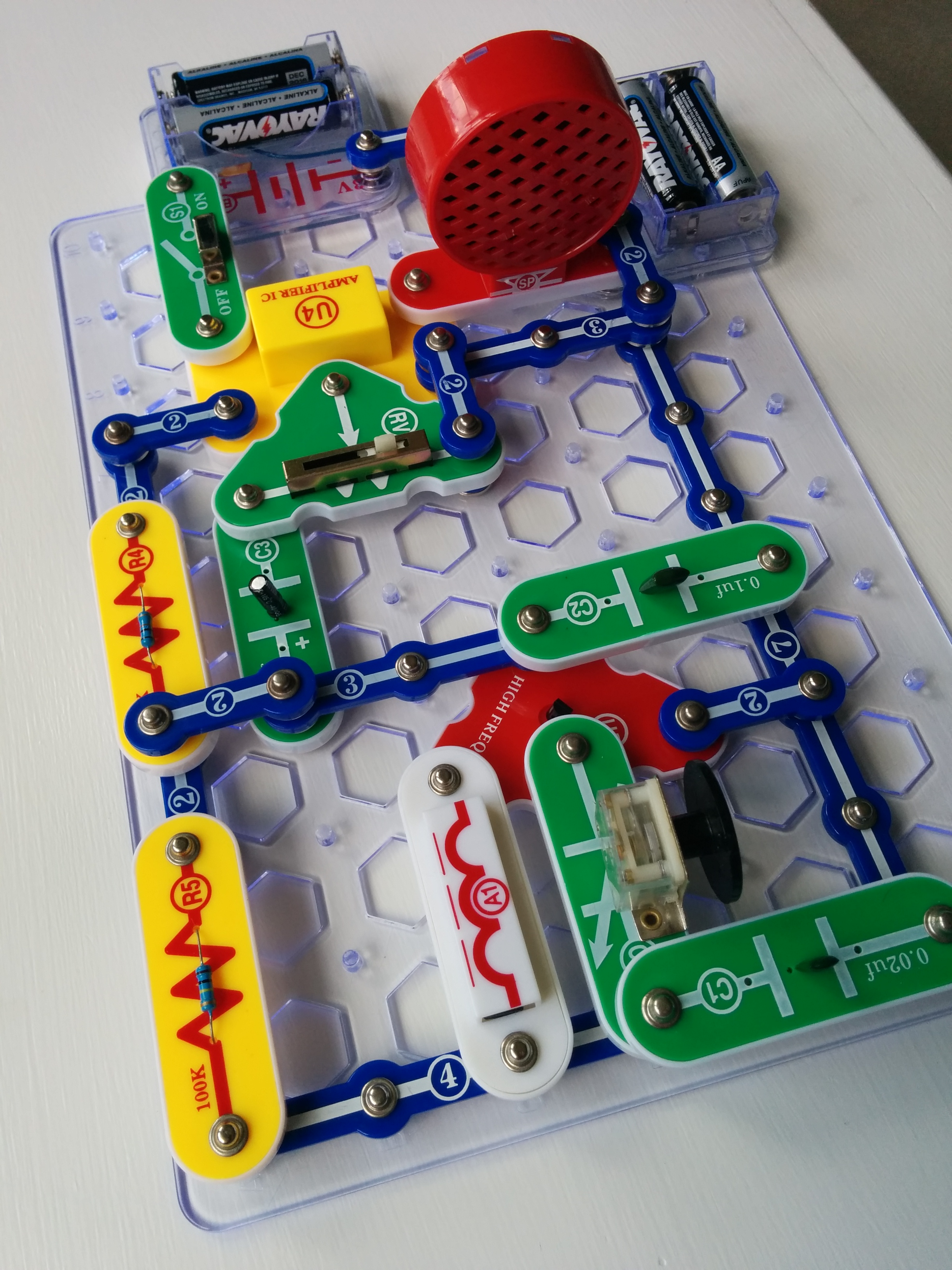 An assembled Snap Circuits radio on a grid