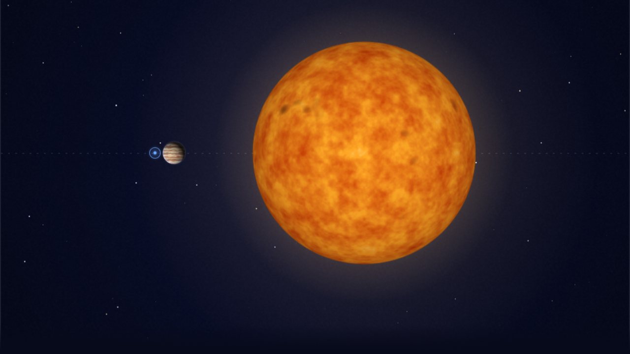 Earth and Jupiter beside the Sun at true relative scale